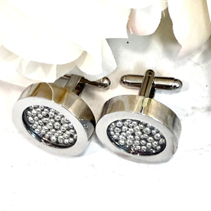 top view of cufflinks filled with pure tine balls and showing bullet back